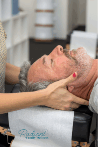Person receiving gentle chiropractic care to support stress relief and nervous system regulation.
