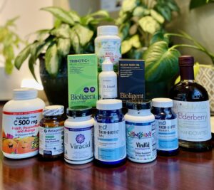 Radiant Family Wellness display of immune support supplements for families, featuring Bioligent, Ther-Biotic, Viracid, and elderberry.