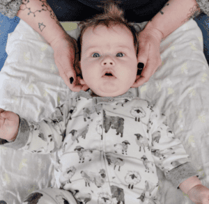 Baby receiving gentle pediatric cranial care at Radiant Family Wellness